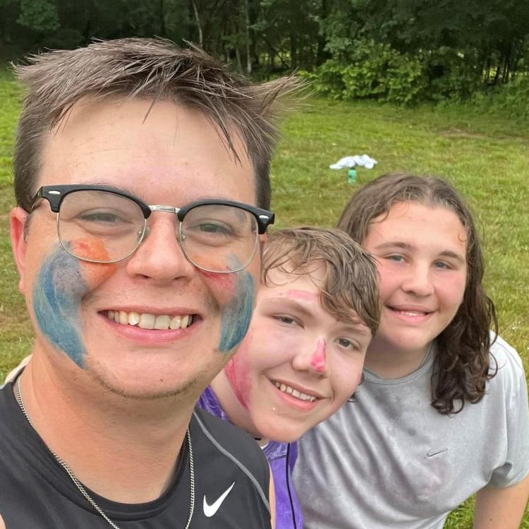  Three people at 4H Camp.