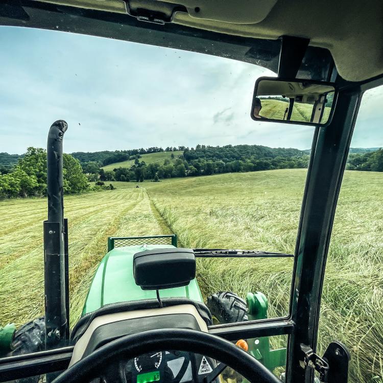  tractor in hayfield